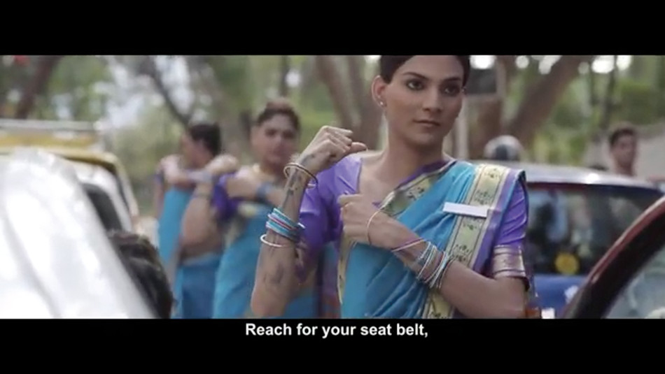 Seat belt crew video screenshot showing women pretending to put their seat belts on