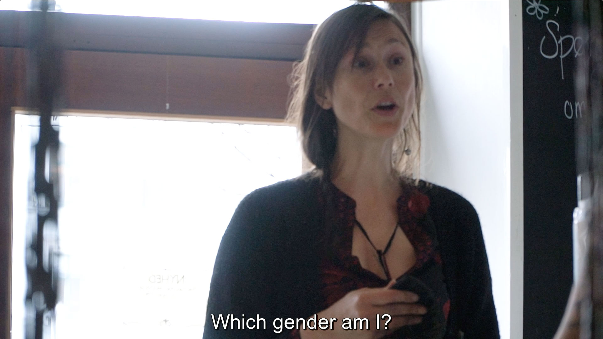 A woman with the subtitle: Which gender am I?